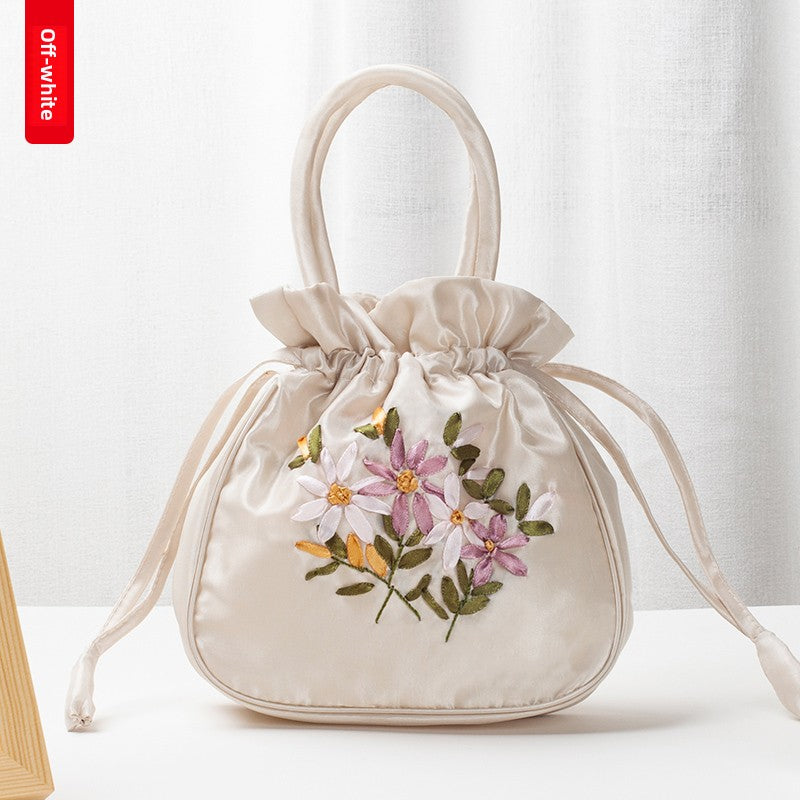 Hand-Embroidered Floral Drawstring Clutch Bag